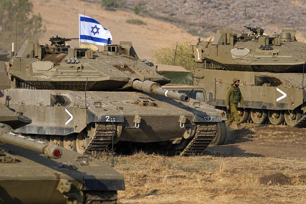 As strikes devastate Gaza, Israel says it's preparing for possible ground assault